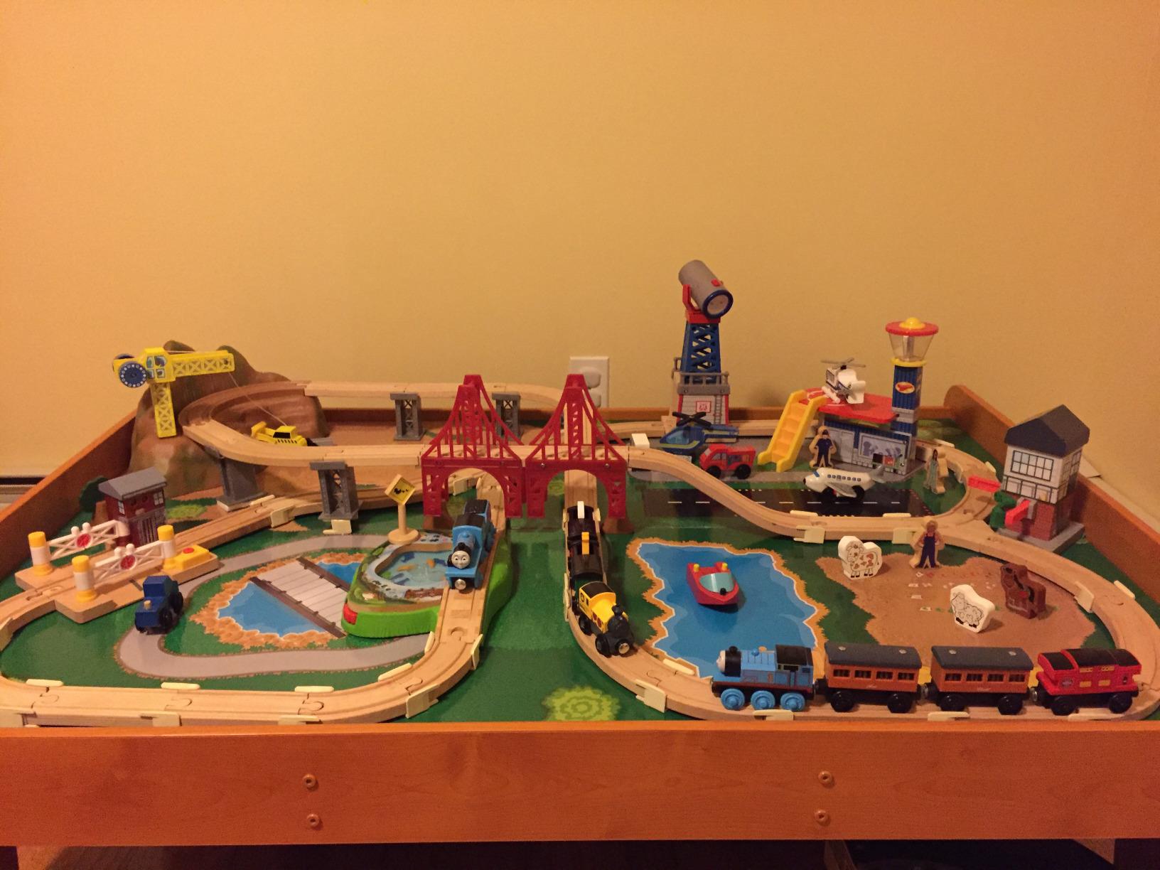 KidKraft Ride Around Town Wooden Train Set and Table with Helicopter, Airplane, Farm, Storage Bins and 100 Pieces, Compatible with Other Major Brand Trains, Honey customer photo 2