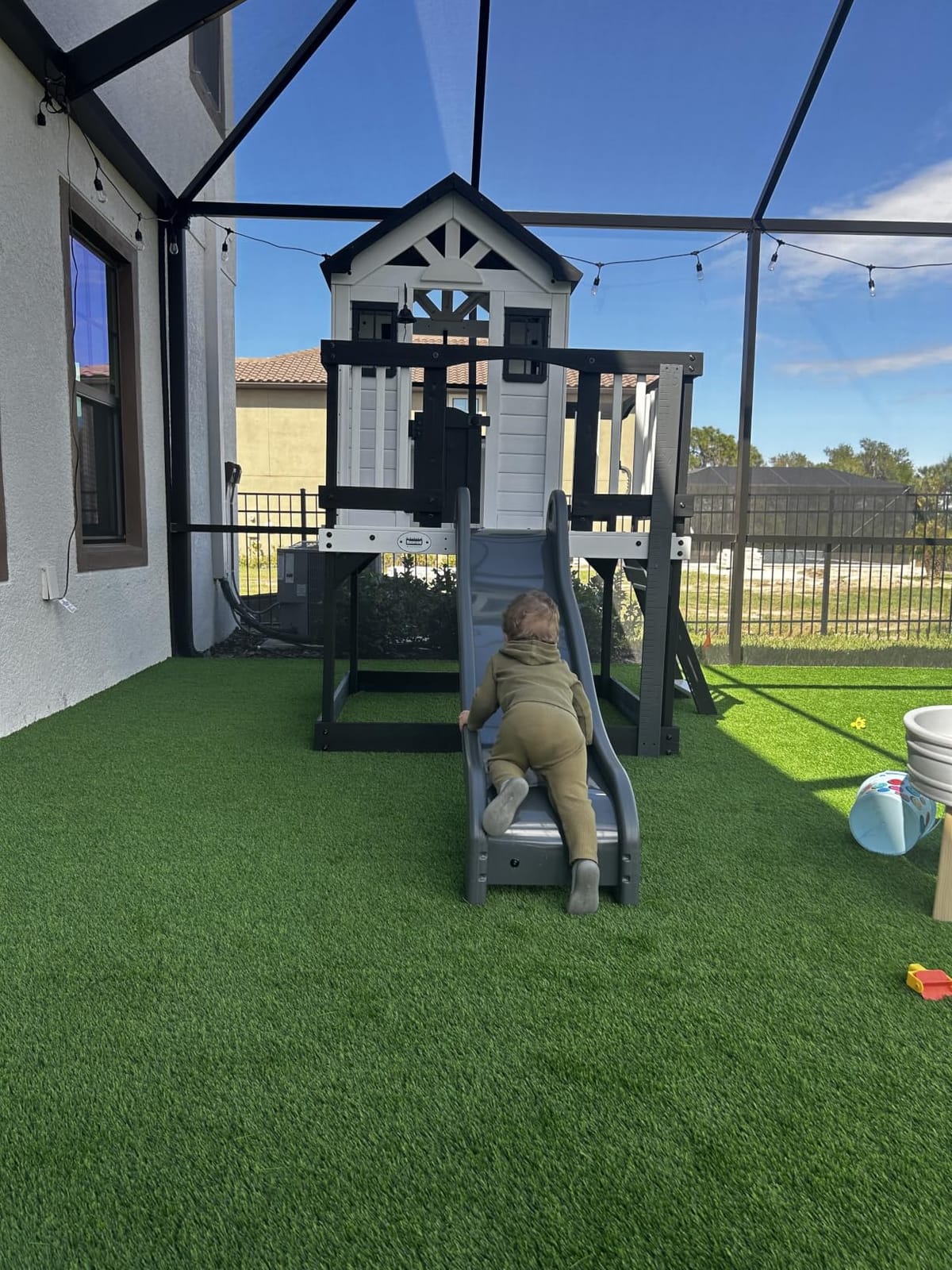 Backyard Discovery Beacon Heights Elevated Cedar Wooden Kids Playhouse with Wave Slide, Play Kitchen, Wrap-Around Deck, Flat-Step Ladder, Half Door, Windows, Bell, and Growth Chart for Outdoor Play customer photo 1