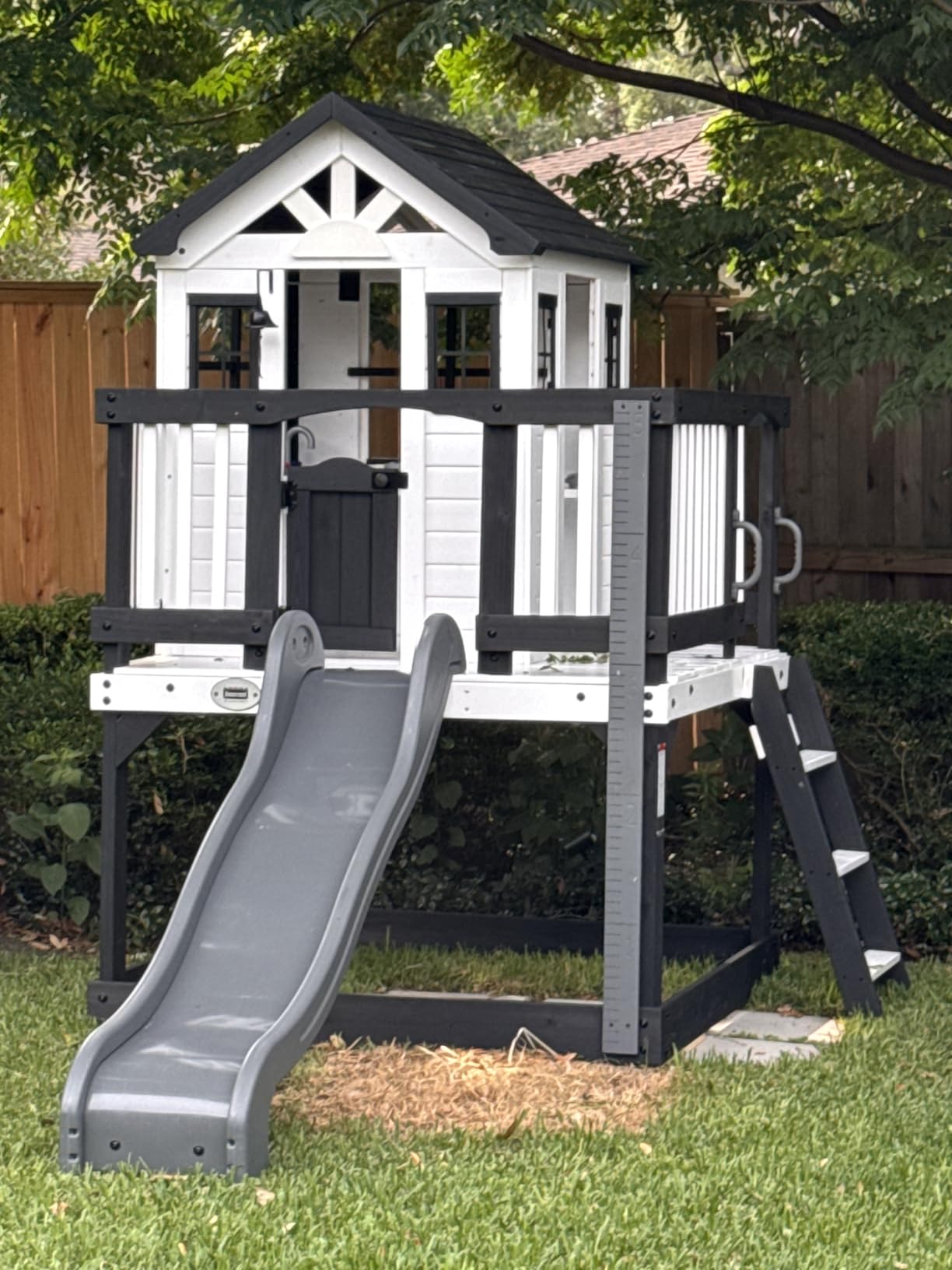 Backyard Discovery Beacon Heights Elevated Cedar Wooden Kids Playhouse with Wave Slide, Play Kitchen, Wrap-Around Deck, Flat-Step Ladder, Half Door, Windows, Bell, and Growth Chart for Outdoor Play customer photo 2