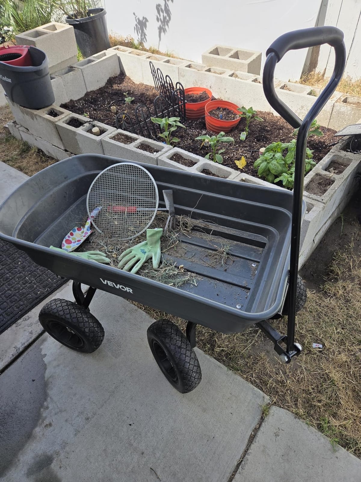 VEVOR Poly Garden Dump Cart 4 Cu.Ft. 600 lbs 4 Wheel Wheelbarrow Dump Wagon | For Orchard Farm, Adjustable Handle, Heavy Duty Yard Cart with 10 in All Terrain Wheels, Steel Frame & Quick Release System customer photo 1